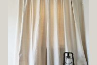 Crafting Elegant Pleated Curtains from Humble Drop Cloths