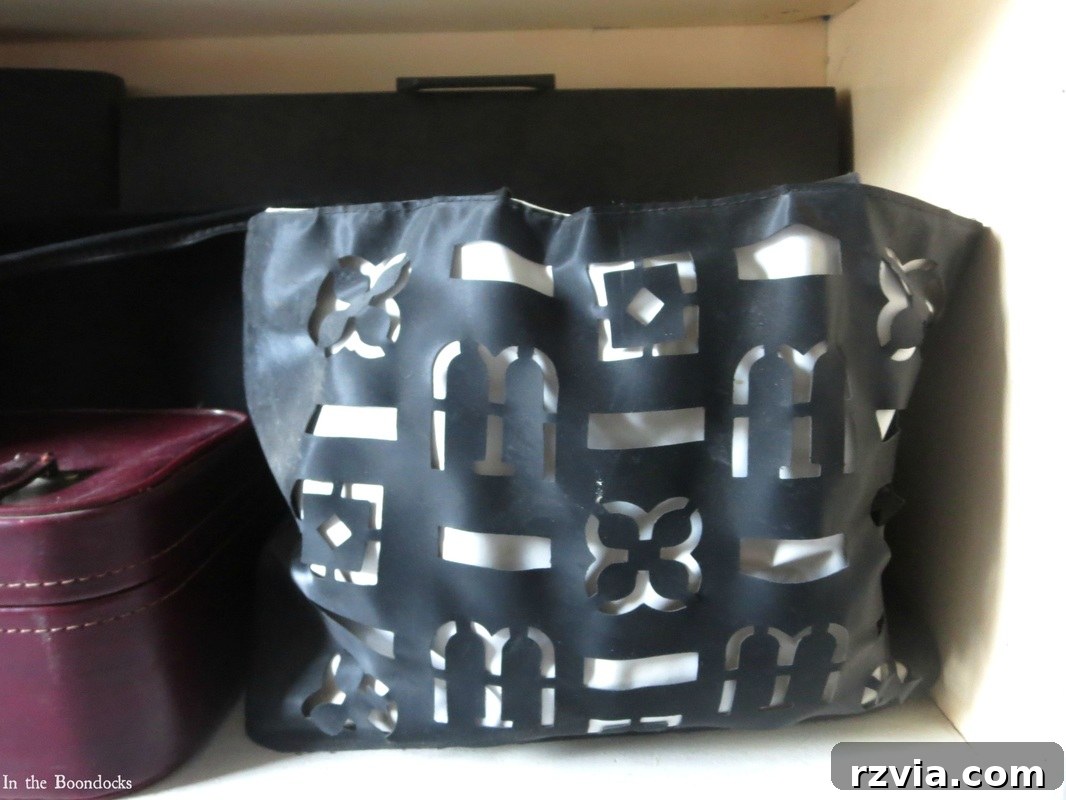 Repurposed Chic: A Teen Girl's Unique Bedroom Makeover 10 Stylish tote bag used to hide hair dryers, contributing to a clutter-free teen bedroom.