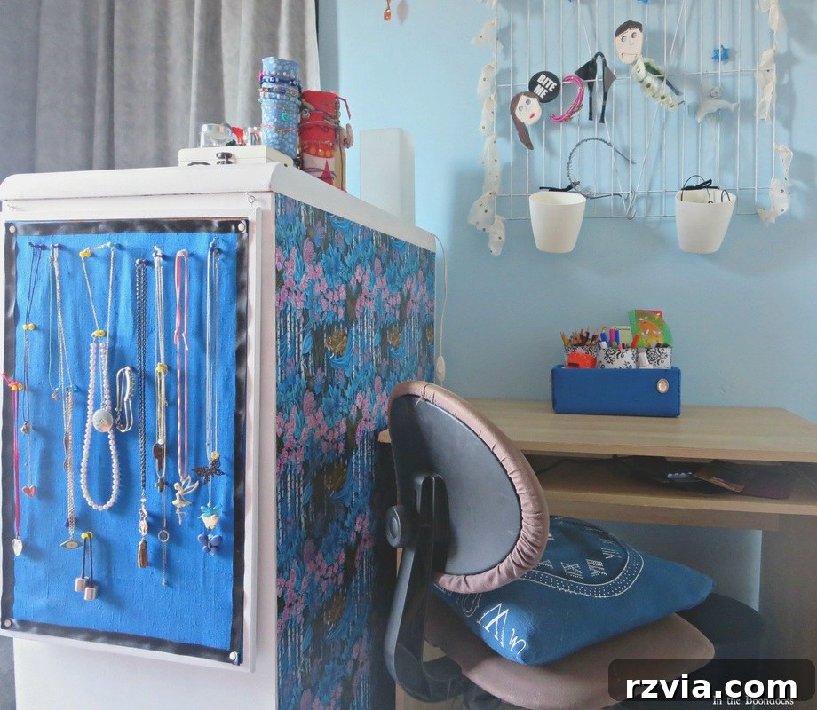 Repurposed Chic: A Teen Girl's Unique Bedroom Makeover 14 Decoupaged back of the dresser, showcasing its role as a room divider in the teen bedroom layout.