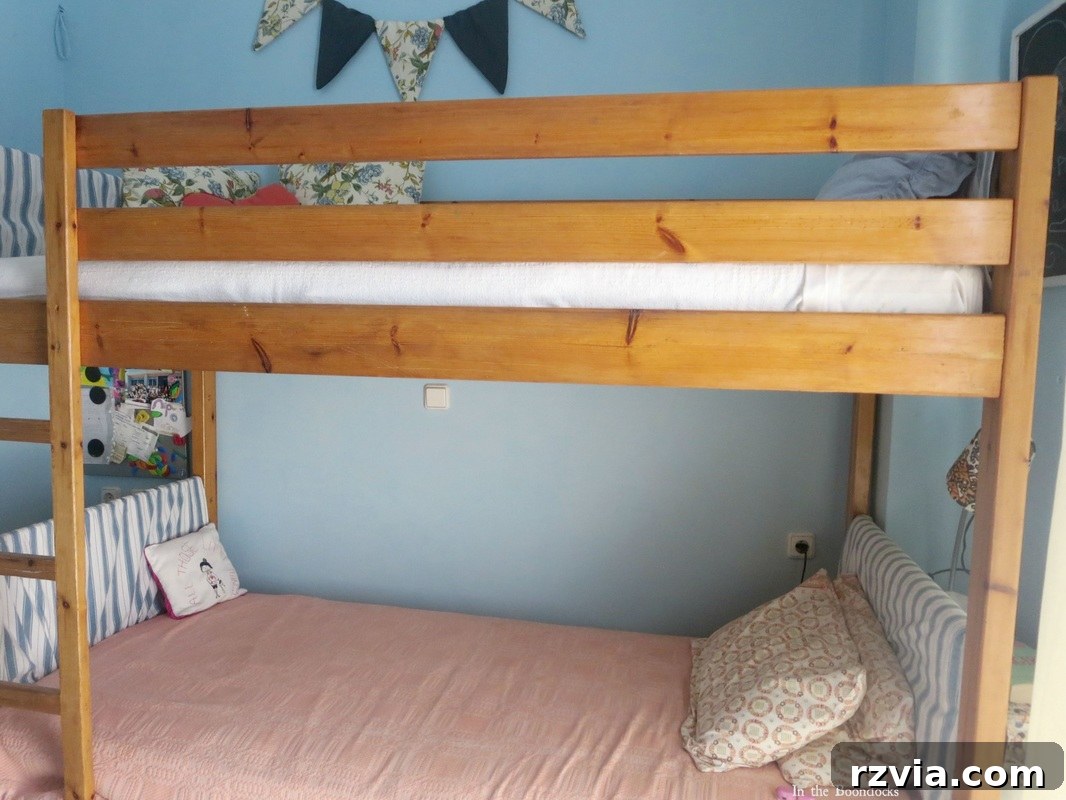 Repurposed Chic: A Teen Girl's Unique Bedroom Makeover 4 After: Walls painted a vibrant blue, part of a budget-friendly teen bedroom makeover. A tour of the new blue room.
