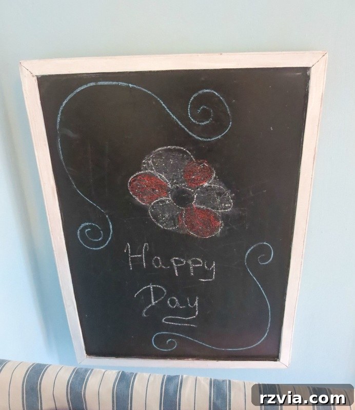 Repurposed Chic: A Teen Girl's Unique Bedroom Makeover 7 Blackboard installed at the head of the bed, a practical and creative addition to a teen girl's bedroom makeover.