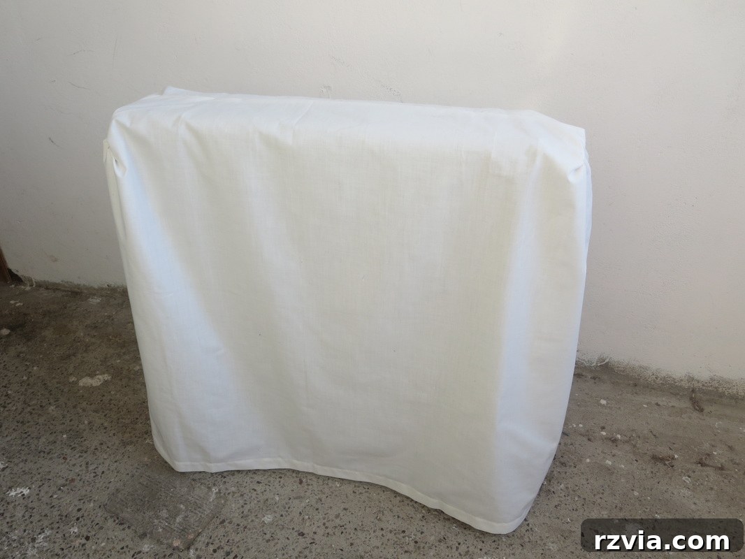 Sewing a fabric skirt from an old sheet to conceal the lower part of the heater. Hiding under the wrong direction www.theboondocksblog.com