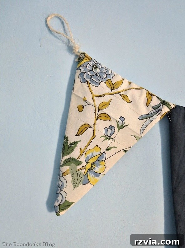 Creative arrangement of repurposed clothes and fabric scraps used to craft a unique DIY banner for the blue room. A step-by-step guide to transforming discarded textiles into stylish and sustainable wall art for any home.