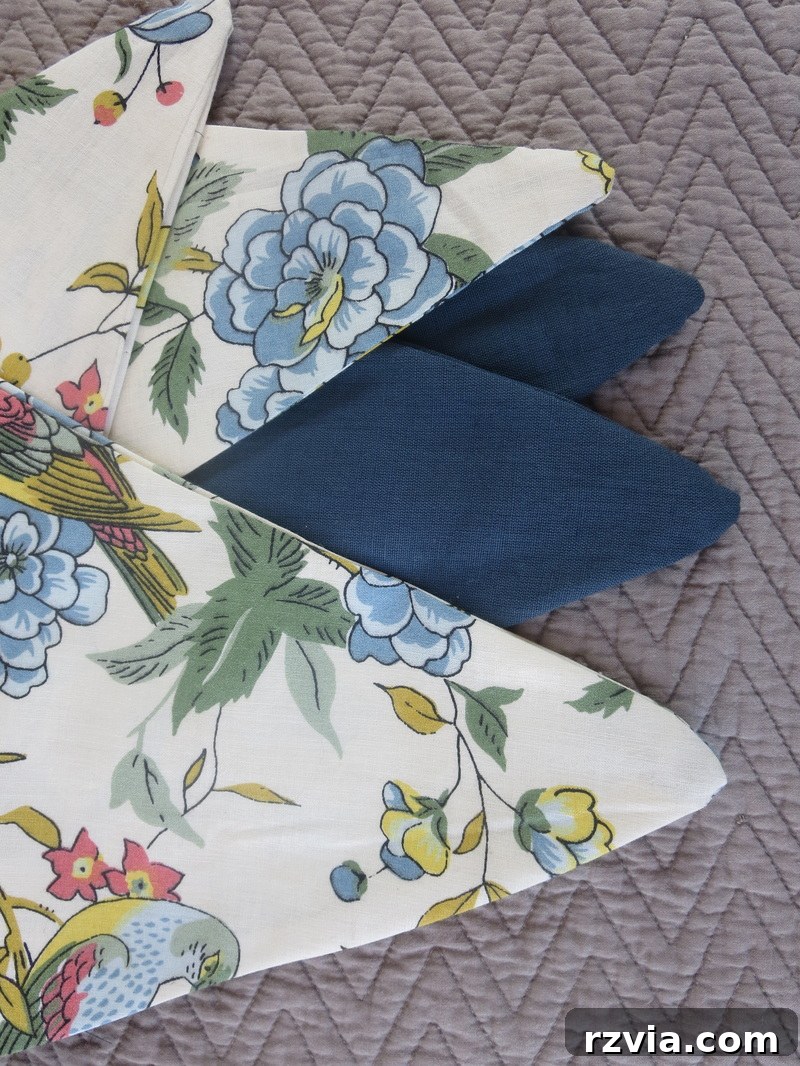 Perfectly ironed fabric triangles, showcasing crisp edges and a stiff shape, an essential step for creating a professional-looking DIY banner. Learn the secrets to polished handmade decor.