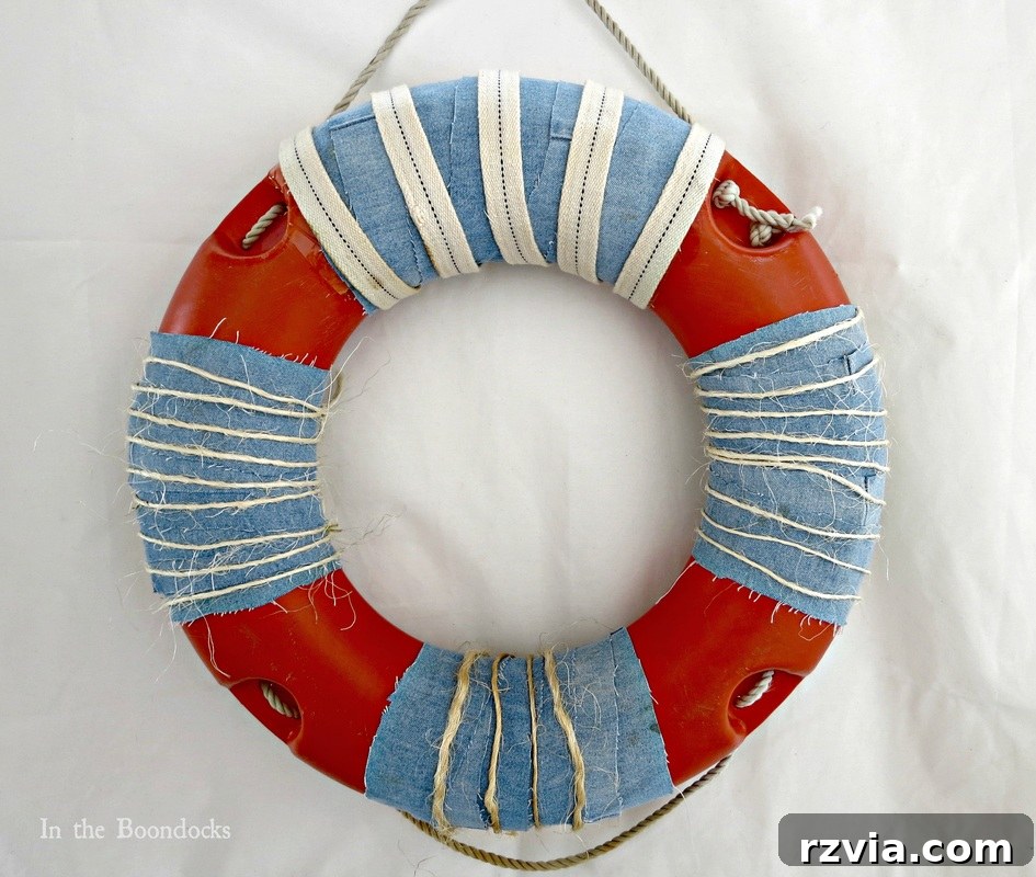 The fully repaired and decorated lifesaver, showcasing its new rustic and beachy aesthetic.