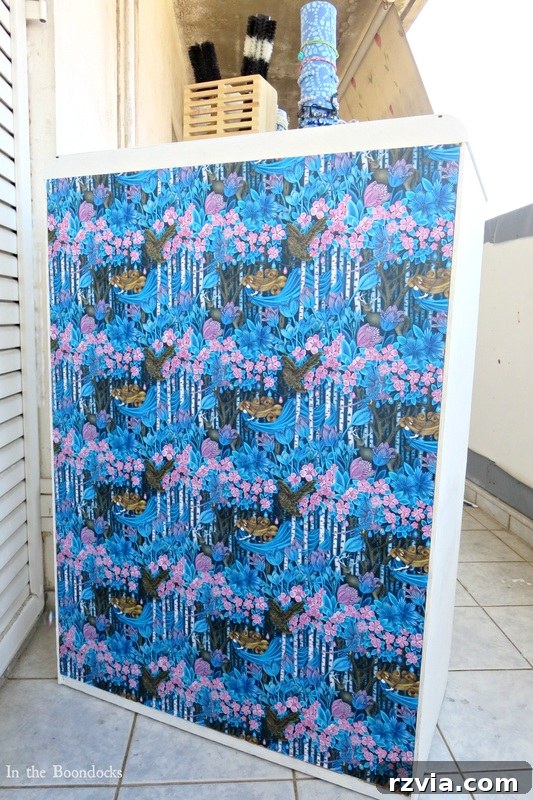Painted Paper Dresser Revival 12 Beautifully decoupaged gift wrap applied to the back of the dresser drawers using Mod Podge, adding an unexpected pop of pattern and color. www.theboondocksblog.com