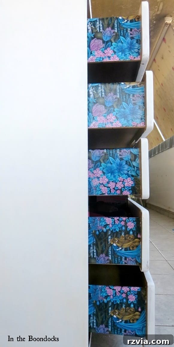 Painted Paper Dresser Revival 14 The stunning 'wow' moment: the dresser's decoupaged sides with floral gift wrap, perfectly complementing the painted finish. www.theboondocksblog.com