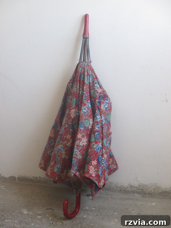 The original old umbrella, the source of the waterproof fabric for the stool makeover.