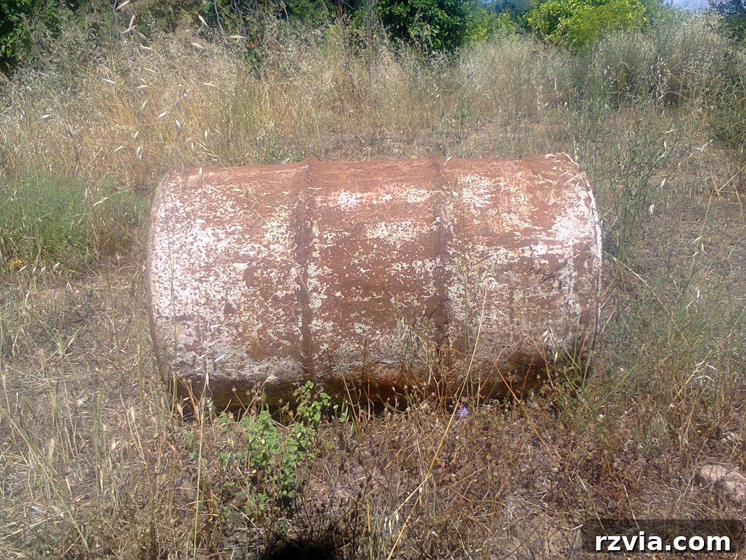 Before shot of an old olive oil barrel