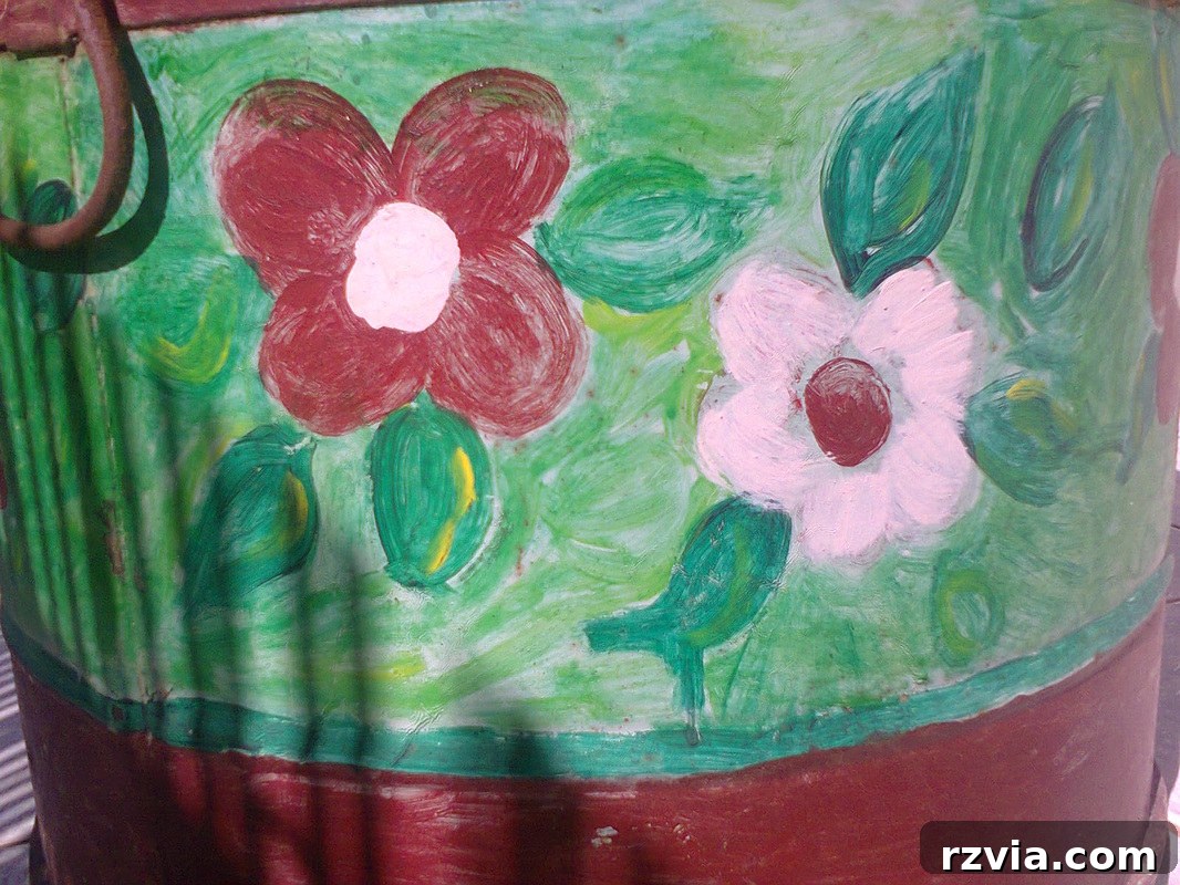 Side view of the first painted barrel with floral designs