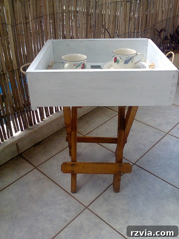 Drawer and stool repurposed into checkered table, #DIYfurniture #repurposeddrawer #repurposedstool #checkerdesigntable #easyfurniture Pieces of a table, www.theboondocksblog.com