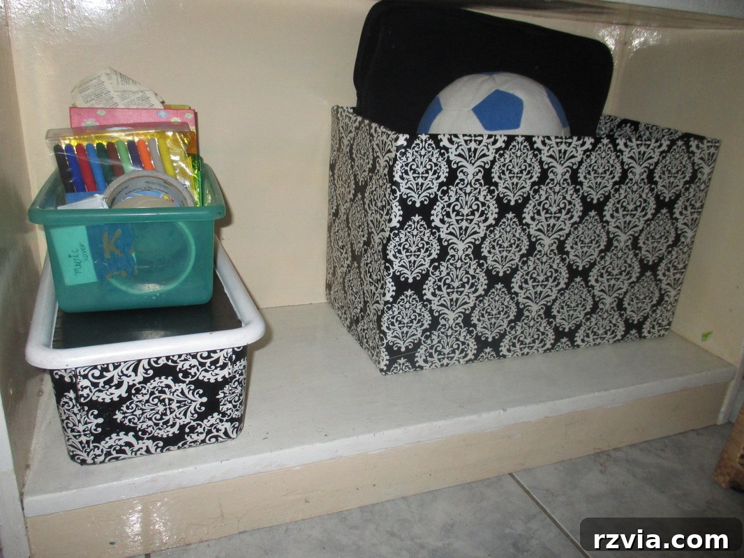 Bookcase with the new box, highlighting the cohesive black and white decor