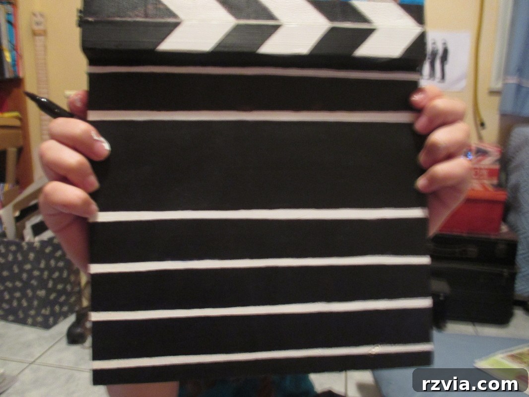 Adding white paint to separate the clapperboard compartments, A sound of inspiration www.theboondocksblog.com