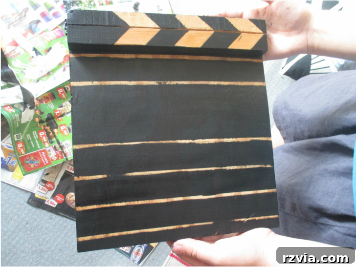 Adding black chalk paint for the clapperboard design, A sound of inspiration www.theboondocksblog.com