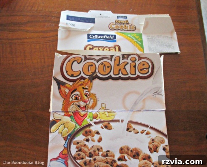 From Clutter to Clever Upcycled Cable Organizers 4 Cut cereal box into even pieces for wire organizer
