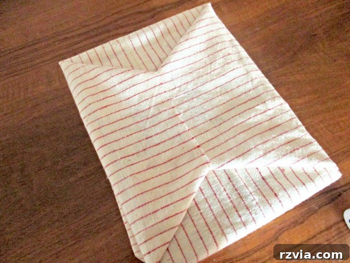 From Clutter to Clever Upcycled Cable Organizers 8 Add fabric to decorated cereal boxes for custom wire organizer