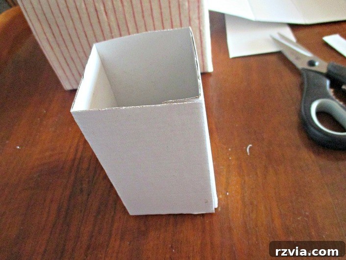 From Clutter to Clever Upcycled Cable Organizers 10 Fold cardboard into a box shape for internal dividers of wire organizer