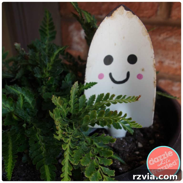 Charming Halloween ghost created from an upcycled garden shovel by Dazzled While Frazzled.