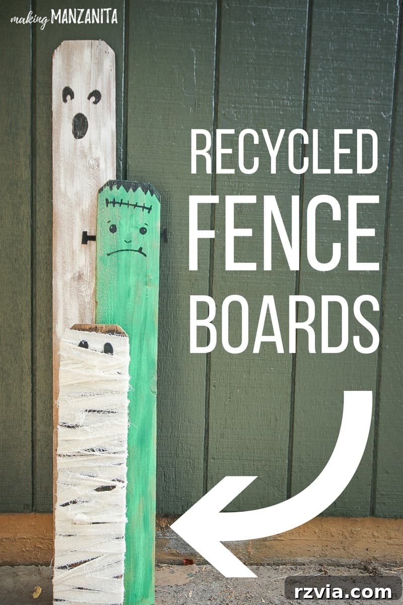 Upcycled fence boards creatively transformed into adorable Halloween porch decorations.