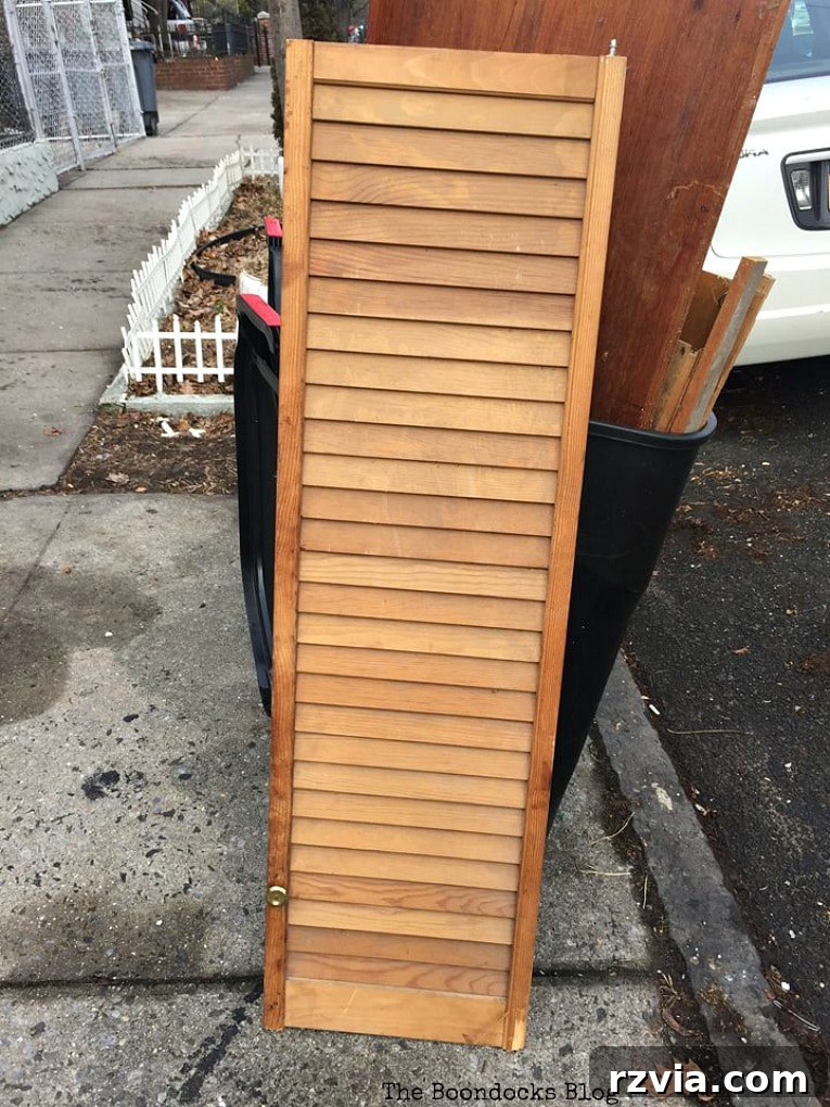 Unconventional Shutter Stenciling Secrets 2 Before: A rustic wooden shutter awaiting its DIY transformation into wall art. Discover how to create unique shutter art with a stencil, even if it takes a few tries!