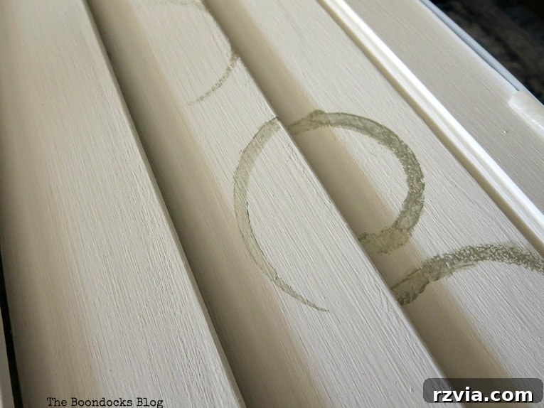 Unconventional Shutter Stenciling Secrets 11 Progress shot of stenciling the shutter slats with thinner brushes, showing improved but still incomplete design coverage. The challenge of stenciling on uneven surfaces persists.