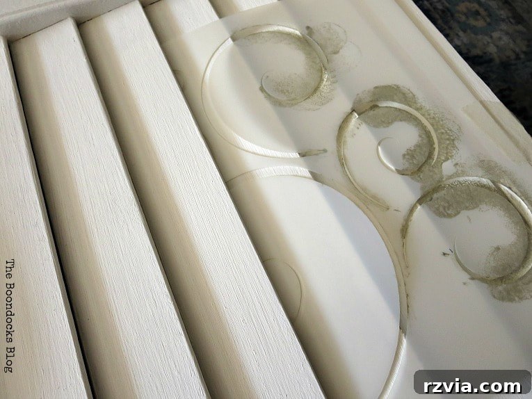 Unconventional Shutter Stenciling Secrets 12 The breakthrough moment: inserting the stencil between the shutter slats to achieve full, flat coverage for the design. A crucial tip for successful stenciling on challenging, uneven surfaces.