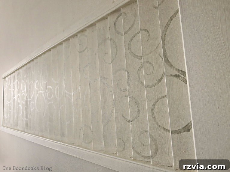 Unconventional Shutter Stenciling Secrets 21 A close-up view of the stenciled shutter art, revealing the metallic finish that subtly shimmers and interacts with light, making the design appear and disappear. A truly unique and delicate effect for wall decor.