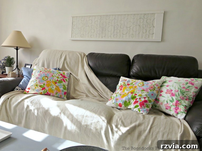 Unconventional Shutter Stenciling Secrets 22 The stenciled shutter art proudly displayed above the sofa, embodying the unique charm of upcycled and handcrafted home decor. A testament to perseverance in DIY projects. #shutterart #stenciledshutter #chalkyfinishpaint #DecoArtMedia #DIYArt #Stenciledswirls