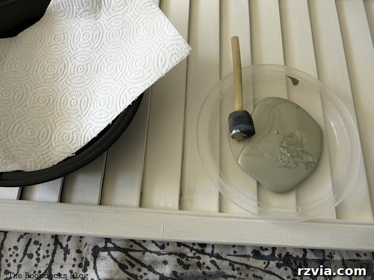 Unconventional Shutter Stenciling Secrets 7 Preparing to stencil with a pounce sponge brush and metallic silver paint, anticipating an easy application. Learn why this initial method proved challenging for a shutter's uneven surface.