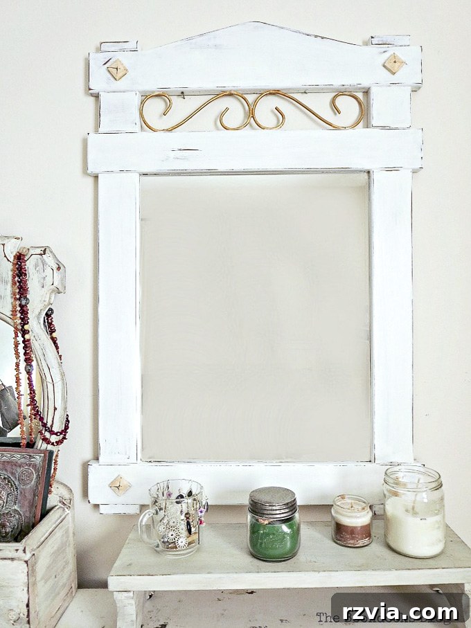 Effortless Side Mirror Refresh 11 The finished wood mirror, beautifully painted with chalky finish and gold metallic paint, distressed and waxed for a captivating vintage farmhouse look. A successful DIY upcycling project.