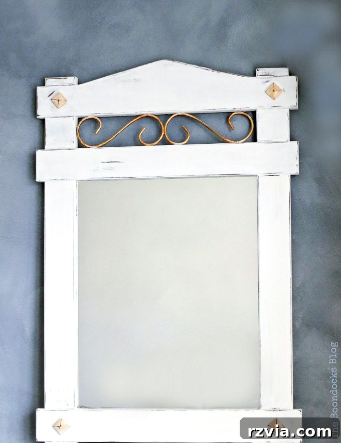 Effortless Side Mirror Refresh 12 A striking display of the newly painted wood mirror with chalky finish and gold metallic paint, artfully distressed and waxed. It perfectly embodies a vintage farmhouse style, a testament to a rewarding curbside find transformation.