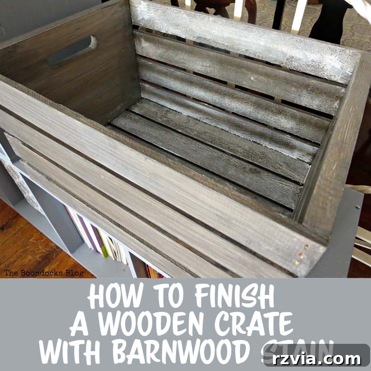 A beautifully stained Michaels wooden crate with a barnwood gray finish, ready for rustic farmhouse storage. Perfect for DIY home decor projects.