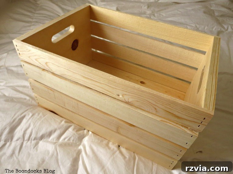 An unfinished wooden crate from Michaels, awaiting its rustic farmhouse transformation.