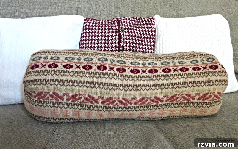 From Discarded to Desired: Upcycling Your Clothes with Style 16 A collection of round bolster and square pillows, all skillfully made from repurposed sweaters, showcasing various textures and patterns.