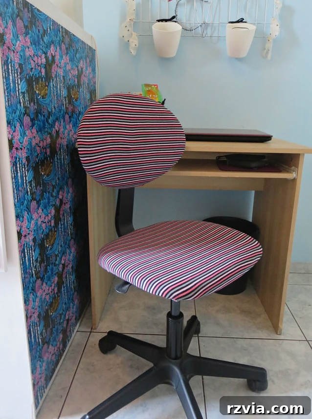 From Discarded to Desired: Upcycling Your Clothes with Style 5 A computer chair with a custom cover made from a repurposed old jersey t-shirt, showcasing a creative upcycling project.
