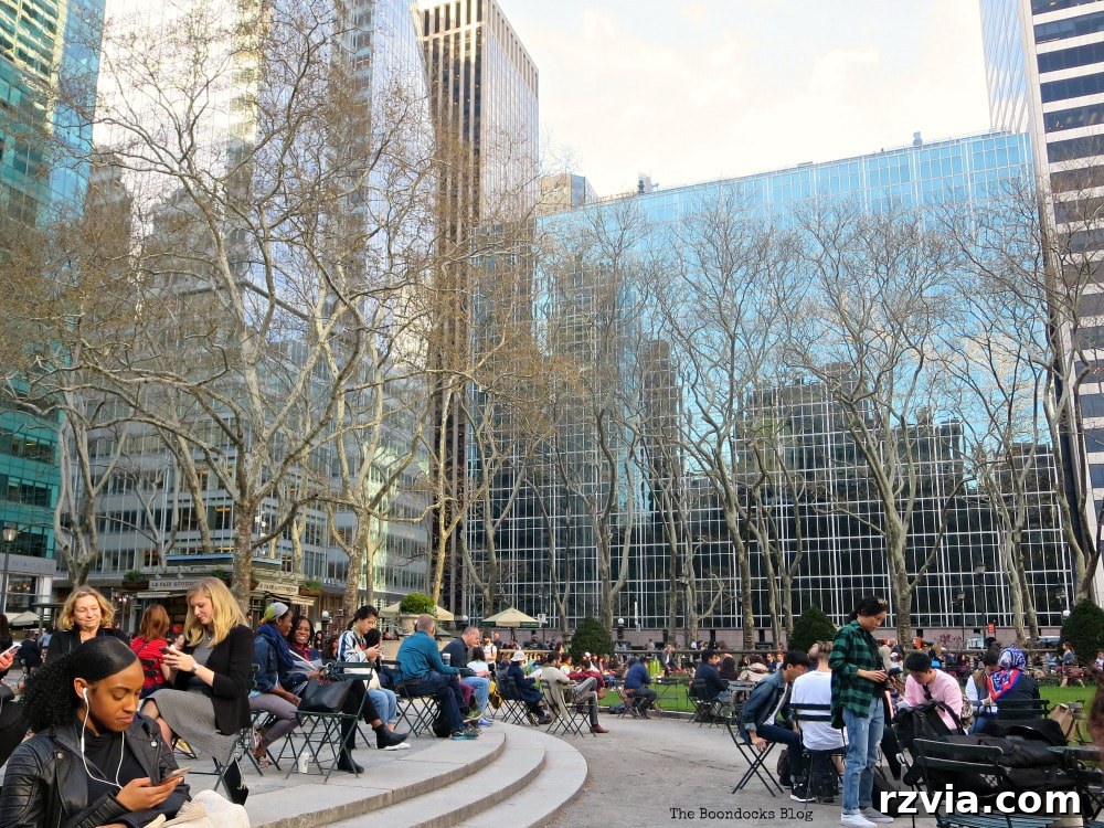 The inviting Fountain Terrace at the west end of Bryant Park, New York, featuring movable chairs and a bustling public space.