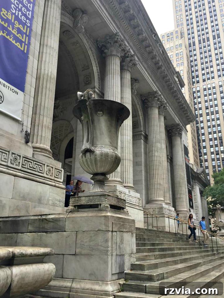 The grand front facade of the New York Public Library's Stephen A. Schwarzman Building, a classic example of Beaux-Arts architecture on Fifth Avenue.
