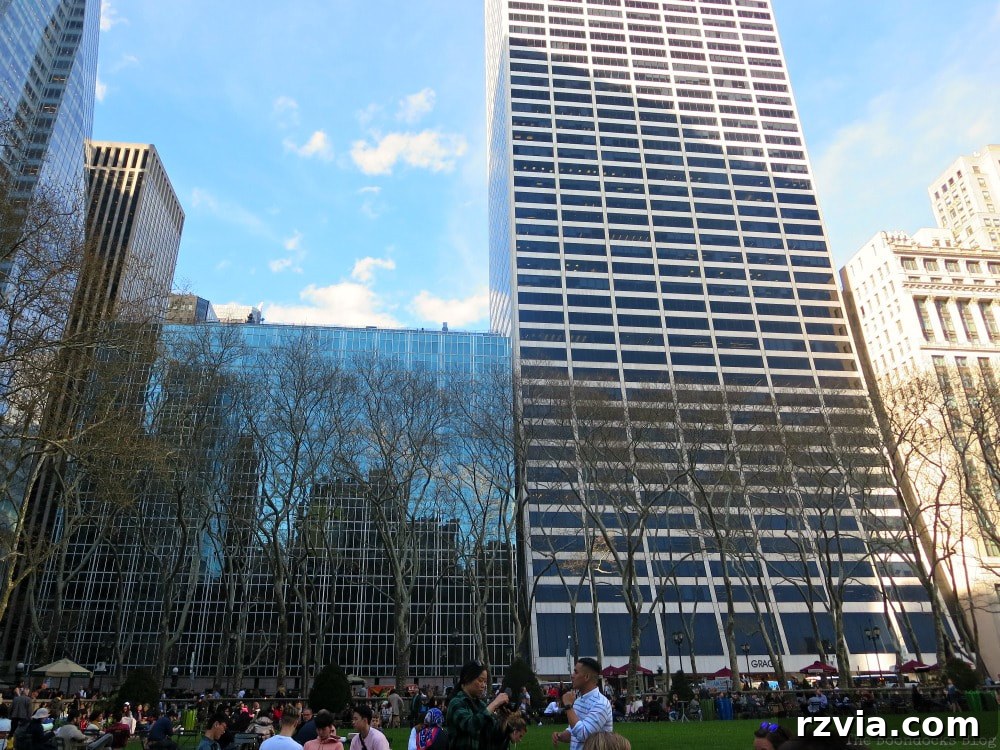 The tall building on the north side of Bryant Park, home to SUNY College of Optometry, showcasing its unique architectural design in New York.
