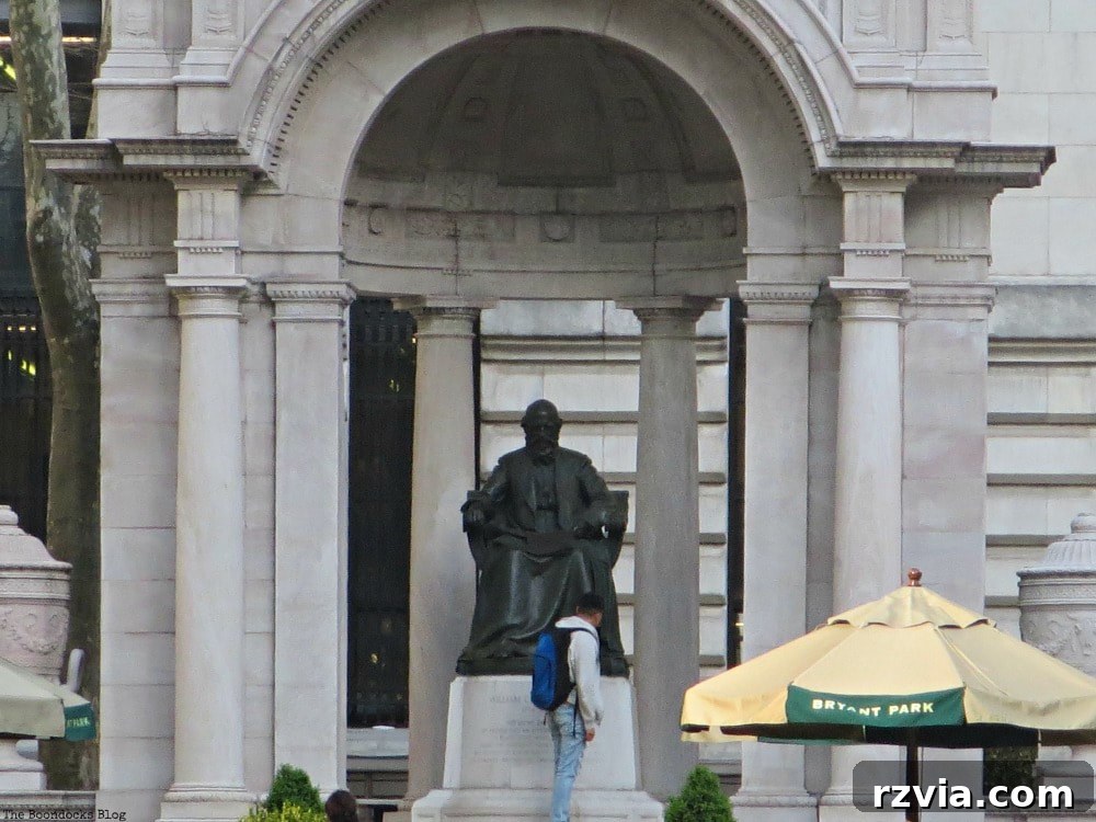 Statue of William Cullen Bryant, the celebrated poet and journalist, standing prominently in Bryant Park, New York City.