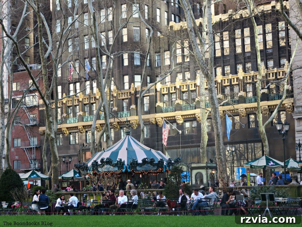 A charming carousel, elegantly designed, adding a touch of whimsy and classic French styling to Bryant Park in New York.