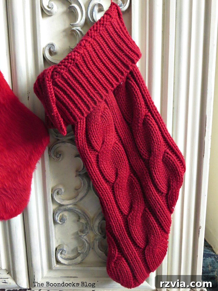 Repurpose Old Sweaters into Christmas Stockings 7 The finished sweater stocking with the top edge folded over to create a decorative cuff.