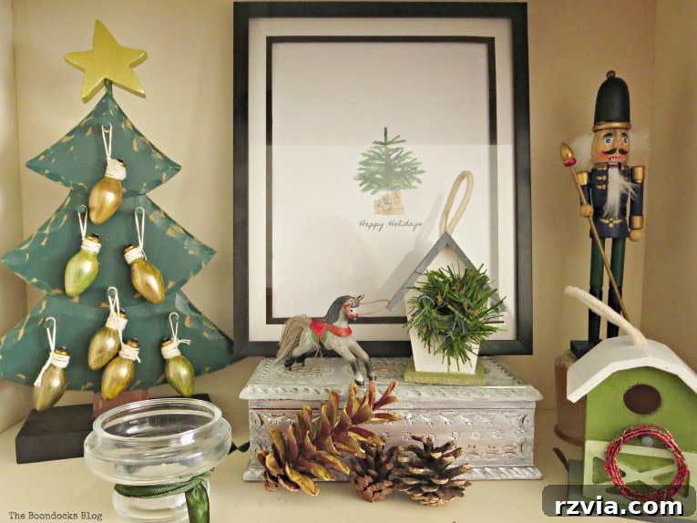 Repurpose Old Decor for Stunning Christmas Vignettes 11 A vibrant green composition on a bookcase, featuring a wooden Christmas tree and handmade houses, embodying a rustic and personal holiday decorating style.