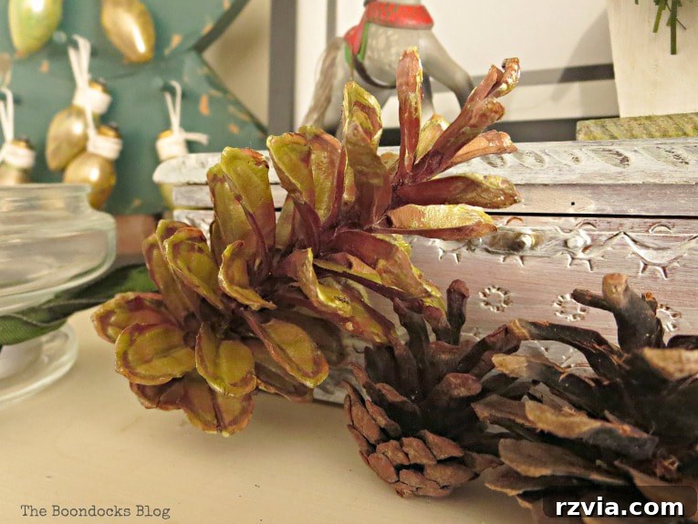 Repurpose Old Decor for Stunning Christmas Vignettes 13 Close-up of gold-painted pine cones, emphasizing their metallic sheen and their versatile role in various Christmas vignettes.