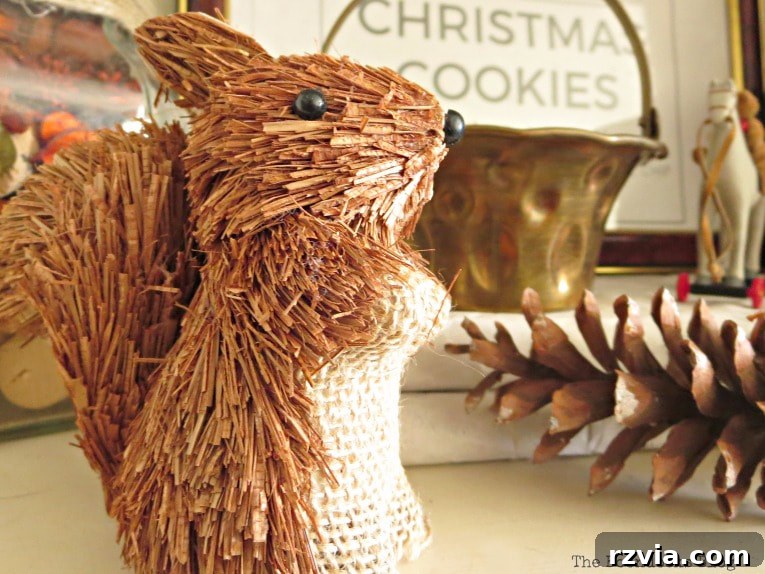 Repurpose Old Decor for Stunning Christmas Vignettes 19 A cute chipmunk ornament perched on a shelf, demonstrating how small, whimsical items can add character to Christmas vignettes.