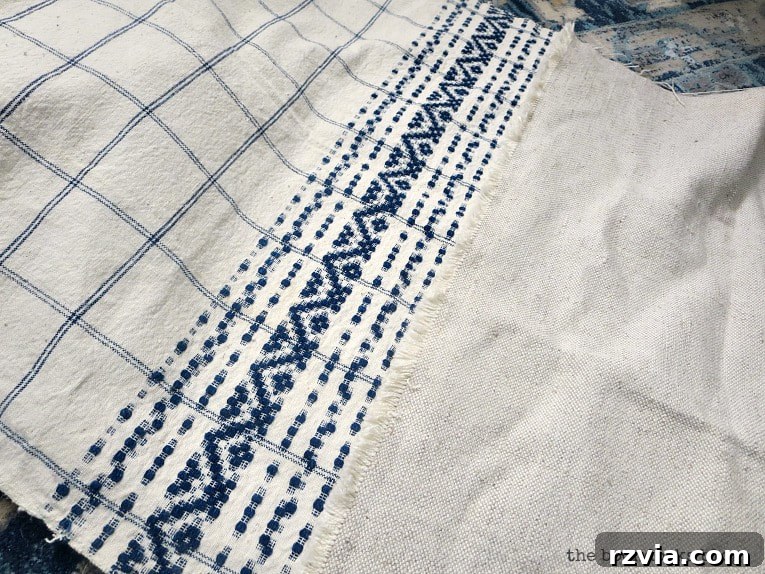 Upcycle Your Fabric Scraps: 5 Easy Pillow Projects 14 Beautiful blue and white antique tea towel, awaiting its transformation into a unique pillow cover.