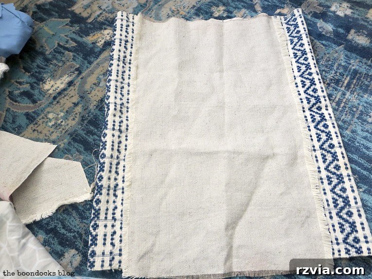 Upcycle Your Fabric Scraps: 5 Easy Pillow Projects 16 Antique tea towel folded and combined with a piece of linen, ready for sewing into a pillow cover.