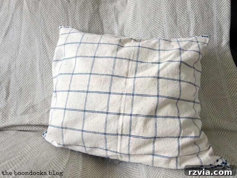 Upcycle Your Fabric Scraps: 5 Easy Pillow Projects 18 The reverse side of the finished pillow, featuring a classic blue and white check pattern from the tea towel.