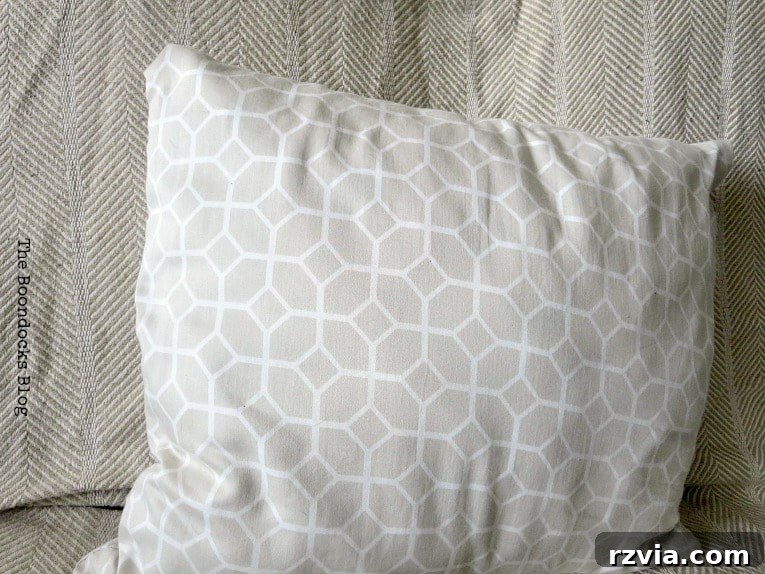 Upcycle Your Fabric Scraps: 5 Easy Pillow Projects 4 Neutral beige geometric patterned pillow cover, creatively made from an upcycled sateen sheet.
