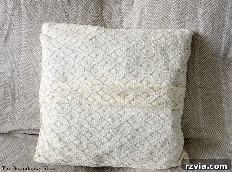 Upcycle Your Fabric Scraps: 5 Easy Pillow Projects 8 Finished lace pillowcase featuring a delicate pleat running down its center, showcasing refined upcycling.
