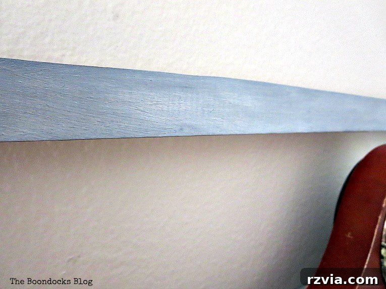 Close-up of the shelf handle, revealing intricate shimmering details.